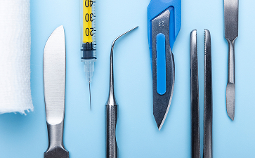 top-view-medical-scalpel-with-other-instruments-medicine 1